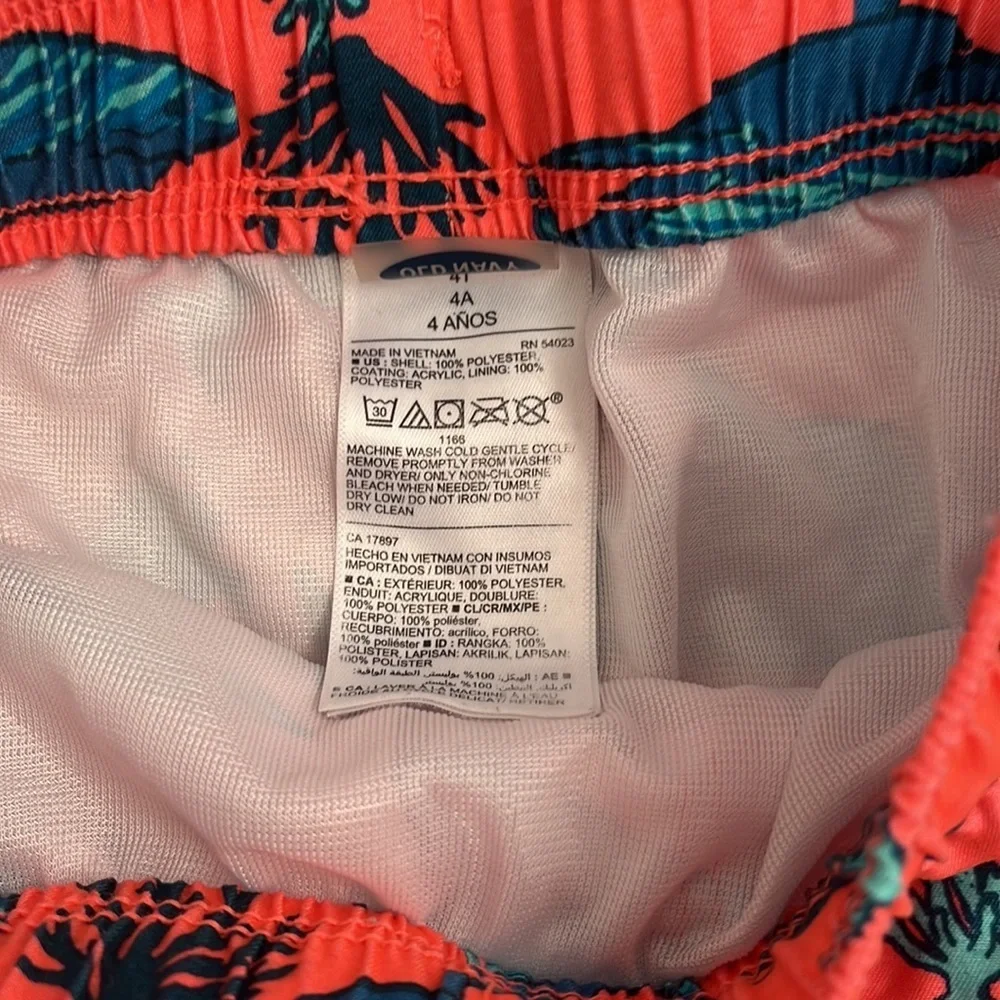 Old Navy coral and teal shark print lined swim trunks